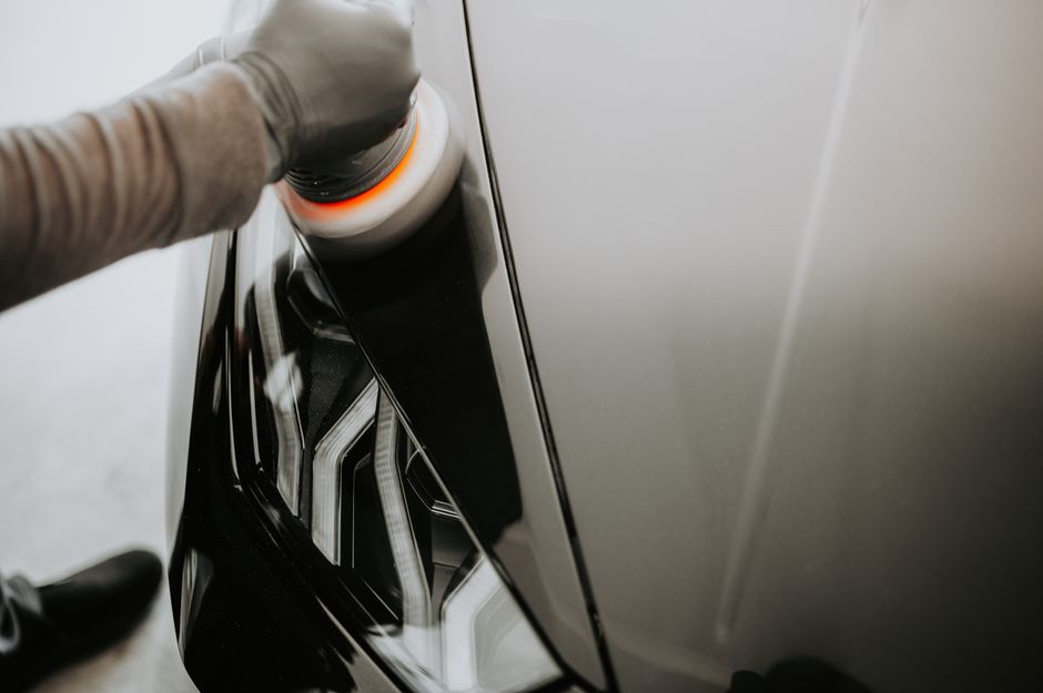 Professional waxing and sealing of car paint